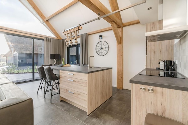 Luxe rietgedekte bungalow aan rustig vijver in Baarle-Nassau - thumbnail 4