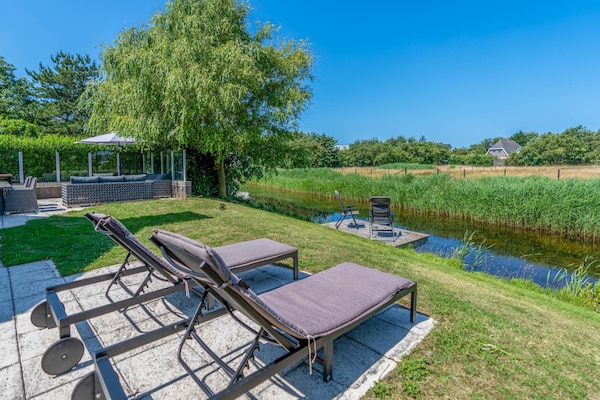 Luxe 6-persoons villa aan het water op 5* park Kamperfoelie, De Koog - thumbnail 2