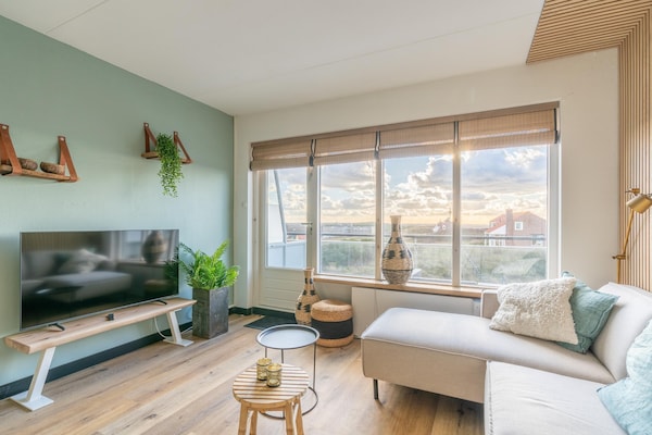 Luxe appartement met sauna, zeezicht en balkon in bosrijke omgeving - thumbnail 1
