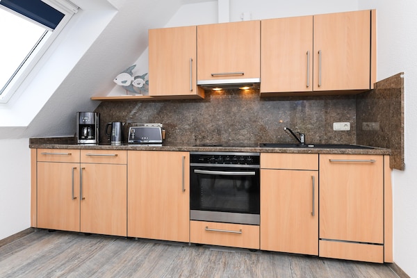 Op 850 m van zee: Knus appartement Haus Strandkorb 7 in Bensersiel - thumbnail 2