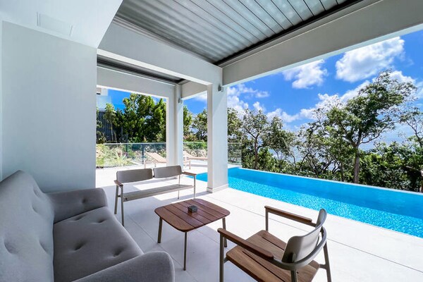 Villa Aqua: Luxe aan Zee met Infinity Pool en 4 Suites in Saint-François - thumbnail 5