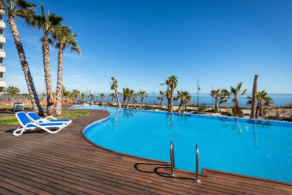 Strandappartement met zeezicht en gemeenschappelijk zwembad in Punta Prima - thumbnail 4