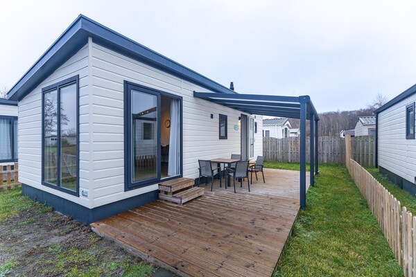 Chalet Schelp: licht vakantiehuis op familiecamping Duinhoeve in Zeeland - thumbnail 1