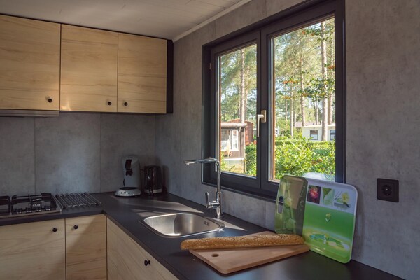 Luxe boslodge voor 4 in Ravels met tuin en zwemvijver - thumbnail 6
