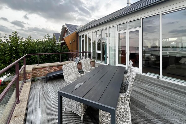 Sterrenzicht: Modern penthouse met panoramisch uitzicht over Uitgeestmeer - thumbnail 4
