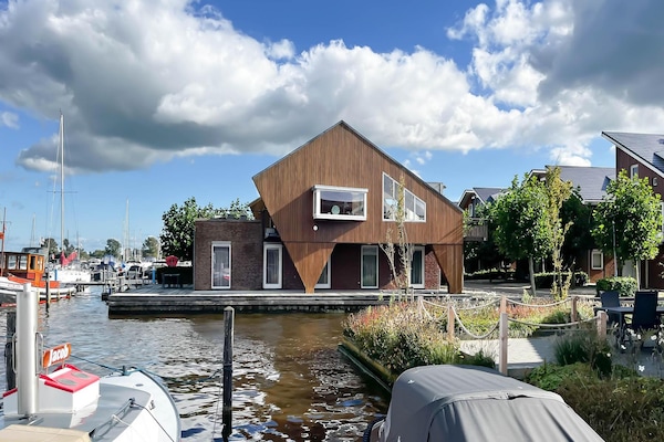 Sterrenzicht: Modern penthouse met panoramisch uitzicht over Uitgeestmeer - thumbnail 1