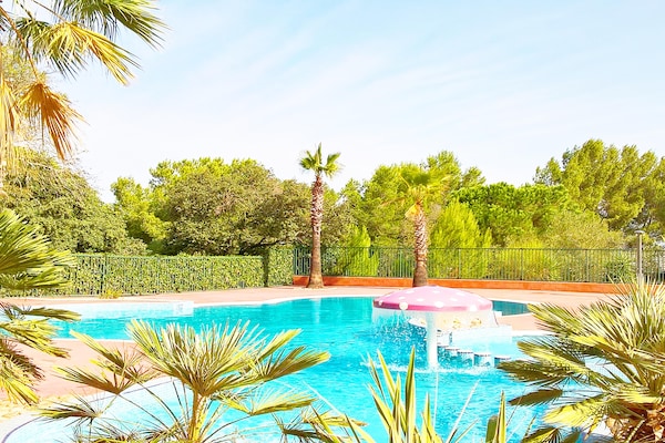 Houten vakantiehuisje in dennenbos bij Cap d'Agde met verwarmd zwembad - thumbnail 1