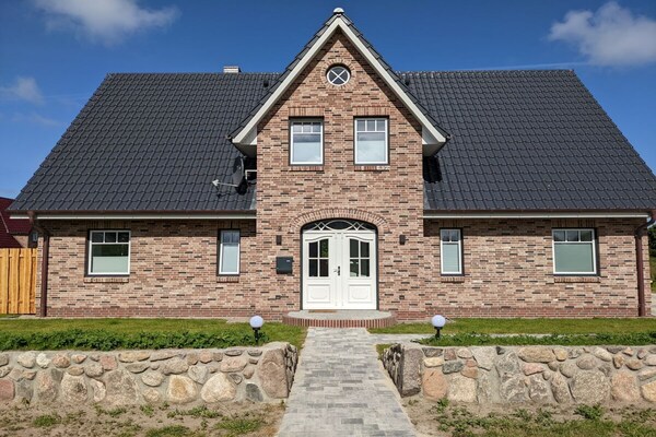 Nieuw vakantiehuis in Utersum met privétuin, 800m van centrum - thumbnail 2