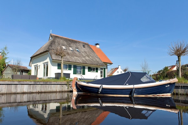 Luxe vrijstaande boerderij aan water met tuin van 1000 m² - thumbnail 5
