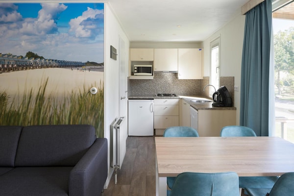 Chalet aan de kust met uitzicht op Oosterschelde en jachthaven - thumbnail 1