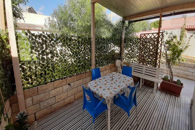 Karakteristieke vakantieVacation house in Porto Palo met een tuin