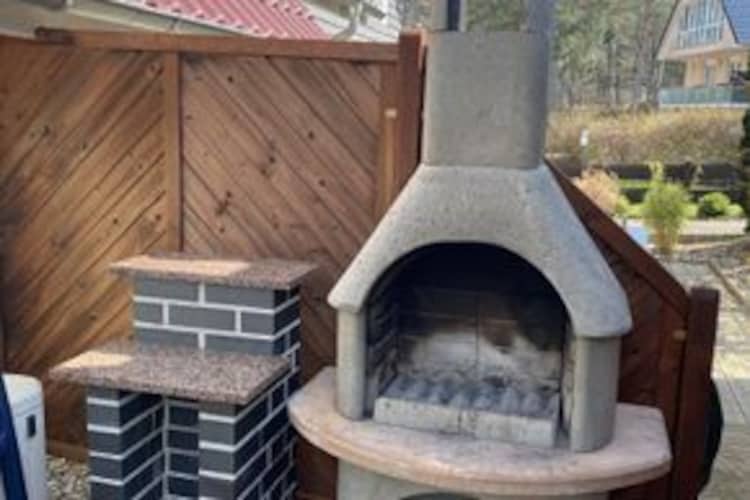 Ground floor: (open kitchen(dining table(8 persons), electric kettle, toaster, cooker(4 ring stoves, ceramic), hood, coffee machine, oven, microwave, dishwasher, fridge(+ freezer)), Living/diningroom(TV(satellite), radio, CD player, heating(floor heating), heating(electric)), bedroom(double bed), bathroom(shower(walk-in shower), washbasin, toilet, washing machine), Landing)\n\nOn the 1st floor: (bedroom(double bed, TV, air conditioning), bedroom(2x single bed(90 x 200 cm, 90 x 210 cm), TV), bathroom(shower, sauna(private), washbasin, toilet), Landing)\n\nAttic: (open sleeping areas(single bed), single bed, TV, air conditioning)\n\nbalcony, balcony, terrace, bicycle storage, garden furniture, BBQ, parking, parking, high chair, outdoor fireplace, baby crib(paid), Towels for a fee, Sheets for a fee