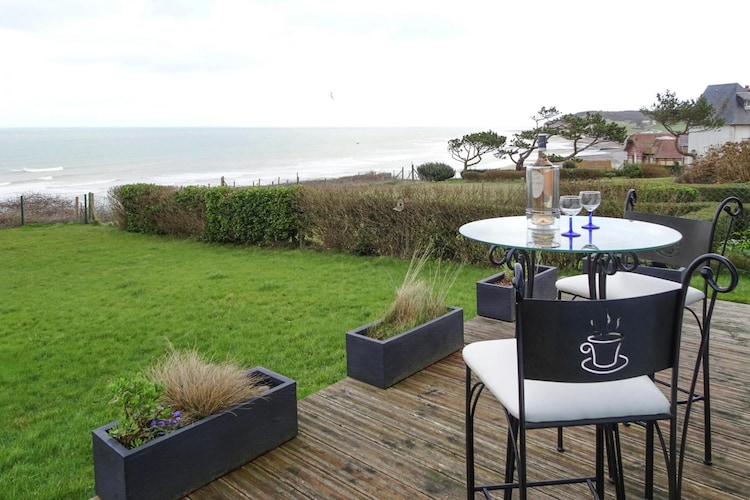 Sea views everywhere! The terrace and living area of this charming holiday home offer a fantastic view of the sea, the huge beach in front of it and the high cliffs that surround the bay. The closed garden property is located in a quiet residential area of the small town. The cozy interior offers a pleasant holiday atmosphere. Quiberville-sur-Mer is located on the Alabaster Coast between the famous port cities of Fecamp and Dieppe. At low tide, the sea pulls back and reveals a wide strip of sand. At high tide, beach sandals are definitely recommended on the pebble beach. Southwest you quickly reach Etretat with its spectacular rock formations, which have been immortalized by numerous artists over the centuries. We also recommend a trip a little further south across the impressive Normandy Bridge to Honfleur, a picturesque port village, or to the famous seaside resorts of Deauville or Trouville. To the north, the Bay of the Somme lures, which is one of the most beautiful bays in the world. A special tip is the picturesque village of Varengeville-sur-Mer, voted the most popular village in France in 2016.

About Belvilla

At Belvilla, you experience holidays exactly the way you want. Choose from an extensive range of holiday homes, apartments and caravan parks from Europe to Florida. From a cabin by the Norwegian fjord to an exclusive villa on the CÃ´te d'Azur, and from an apartment in Rome to a country estate in Tuscany. At Belvilla you will find the perfect holiday home for an unforgettable time with your family, partner or friends. You will also find holiday homes for larger groups, spread across various regions in Europe.

Belvilla offers a wide variety of holiday homes: small and cosy with a sauna or spacious with an outdoor pool, roof terrace and numerous bedrooms. At Belvilla, for example, you can choose from holiday homes in prime locations, with luxury amenities and homes particularly suitable for families. Of course, many holiday homes also have a space reserved for your dog. You can choose from practical holiday homes in popular holiday destinations, city houses in cosmopolitan cities such as Venice or Rome, dreamy holiday homes in top locations and spacious holiday homes with unique furnishings. Besides holiday homes by the sea, Belvilla also offers holiday homes with swimming pool and/or wellness facilities.