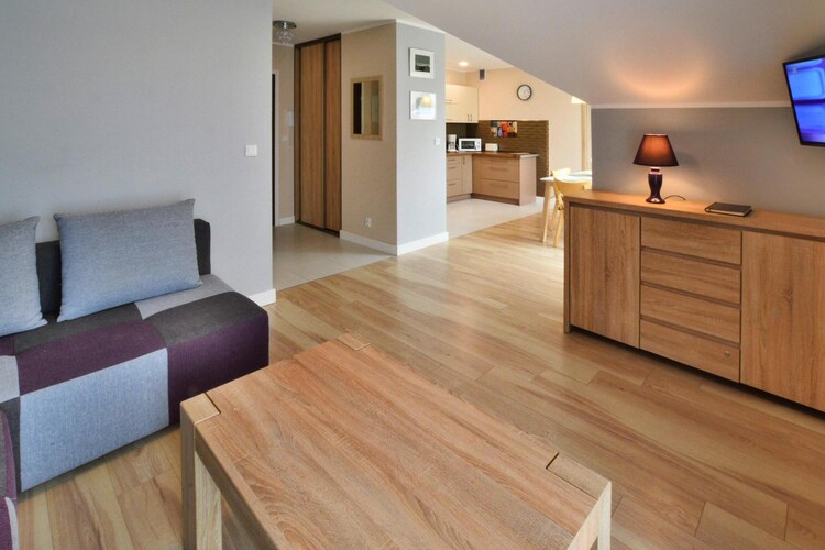 Interesting location, 400 m from the beach, in the immediate vicinity of the water park. The resort centre is approx. 600 m away. You can get to the western part of the city via a drawbridge over the Wieprza River. Near the mouth of the river, there are cruise ships, water equipment rentals, and numerous stands with smoked and fresh fish.
A comfortable holiday apartment awaits guests in the apartment complex. The apartment is on the second floor. It consists of a spacious living room (double sofa bed, TV, table), a bedroom with a double bed (additional TV) and a bathroom with a shower. The living room is connected to a well-equipped kitchen. The apartment has a large balcony with a seating area. Central heating. Wireless internet is available.
There is a free parking space by the apartment.
The price of your stay includes: bed linen, towels, electricity and water consumption, heating, parking, internet, final cleaning, tourist tax, baby cot and high chair (reservation required).
Darłówko is a seaside district of the city of Darłowo. The charm of this town attracts thousands of tourists every year. A wonderful microclimate, a clean, wide beach and the attractions of the old, medieval city. Darłowo awaits tourists all year round. In addition to beautiful beaches, Darłowo's hallmarks are: a lighthouse, a sliding bridge, a port and many other interesting places. In Darłowo there is a marina where you can rent water equipment and a port from where cruise ships sail. Nearby there is also an attractive aquapark at the Hotel Jan.