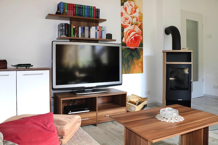 Ground floor: (Living room(single sofa bed, TV(satellite), fireplace, DVD player, radio, CD player), Kitchen(dining table, electric kettle, toaster, cooker(4 ring stoves, ceramic), hood, coffee machine, microwave, dishwasher, fridge), bedroom(double bed(boxspring, 180 x 200 cm), TV(satellite)), bedroom(bunk bed(80 x 200 cm), TV(satellite)), bathroom(shower, washbasin, toilet))\n\ncarport, seating area, grill, washing machine(shared with the owner ), heating(floor heating), garden(shared with the owner ), bicycle storage, garden furniture, parking, parasol, high chair, baby crib(free), Laundry Package for a fee