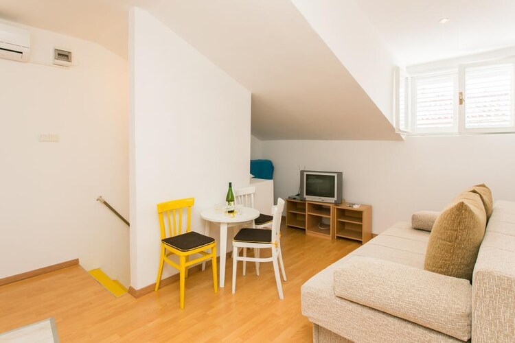 Apartment Sun is set within the UNESCO-listed Dubrovnik Old Town, just a few steps away from the vivid Stradun Promenade.



Luggage storage before check in and after check out are available, so that you can explore the town a bit more before departure.

This lovely one bedroom apartment is a perfect fit for up to three persons.
It features WiFi, air-conditioning and cable TV. Kitchenette is well equipped  and comes with combined dining and seating area with sofa. 
Private bathroom includes shower cabin.

The apartment is located just 600 meters from the nearest beach Banje, with many more of them in surrounding area and beautiful island Lokrum just a 15 minutes boat ride away. There is an open-air green market and other shops within walking distance, as well as a bakery, banks and ATMs, cafes, bars and restaurants with local and other cuisine. Famous night club Revelin, located inside the old fort, is just 150 meters away.

There is no need for public transit while you're staying here, but if you want to see other parts of the town, for example peaceful Lapad Bay, You can be there in a 10 minute drive. Taxi and bus station are 5 minute walk from the property.

Dubrovnik Bus Station and Ferry Port, connecting the mainland with various Dalmatian islands, are 15 minutes ride from the apartment, while Dubrovnik Airport is 20 km away.