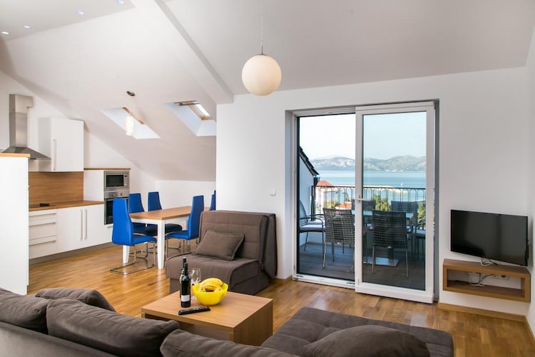 Fancy Apartments Kula in Drače, Dubrovnik-Neretva County, Croatia, offers modern, well-equipped accommodations featuring free Wi-Fi, air conditioning, and a fully equipped kitchen. Guests can enjoy in private balconies or terraces. Located in the charming coastal village of Drače, it provides easy access to local beaches, restaurants, and attractions, making it ideal for couples, families, and groups seeking a comfortable and scenic stay on the Pelješac Peninsula.

Note:

*****Please note that a city tax of €1.50 per person, per night is not included in the price and is payable directly at the accommodation. The tax is reduced by half for children aged 12-18, and there is no tax for children under 12*****

Private parking is available, reservation is not required.
Baggage drop-off is available before check-in.
Baby cot is available on request.

This modern three bedroom apartment features free WiFi, air-conditioning, well equipped kitchen with dining area, an SAT/flat-screen TV living room with sofa and a two private bathrooms. Private bathrooms comes with shower and a hair dryer. It will also provide you with a lovely furnished balcony with a sea view. This three-bedroom apartment can comfortably accommodate up to 8 persons.

Thanks to its excellent location, everything you'll need for your vacation is just a short walk away from the property. Grocery stores, cafes, restaurants—everything is within a 500 m radius. The beach is 100 m away from the property.

The nearest airport is Brac Airport, 74 km from Apartments Kula. Dubrovnik Airport is only  97 km from the property.