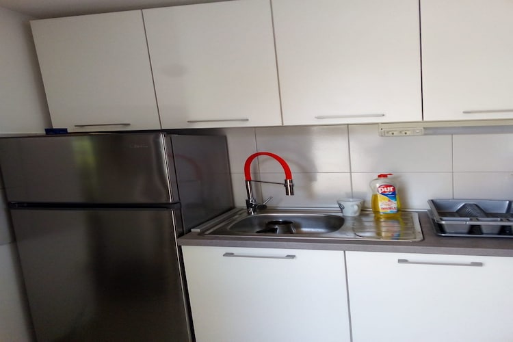 Apartments Sea Eyes are located on Vir, an island that lies in Dalmatia, north of the city of Zadar 28 km away from it. 

Shared garden, sun loungers and sun umbrellas are at your disposal.  All the units have access to a private terrace or balcony. Washing machine, iron and ironing board are at your disposal. 

Private parking is available, reservation is not required. 
Luggage storage is possible prior to check in and after check out.

Studio apartment is located on the ground floor, two bedroom apartment is on upper floor.

This studio apartment with terrace and sea view can perfectly accommodate two people. It features free WiFi, air conditioning as well as Cable LCD TV. Kitchen is equipped with an oven, refrigerator, water kettle, microwave, freezer, trash cans, stove and kitchen utensils.  The private bathroom comes with shower and toilet.
This apartment is located on the ground floor.

Due to the properties good location everything you may need during your stay is in the area. Beach is only 30 m away! Restaurant and caffe bar is 50 m away, while market is only 500 m away. You can find a pharmacy, bank and ATM in the radius of 1 km.

Bus stop is 500 m from the property. Airport Zadar is only 36 km from Apartments Sea Eyes.