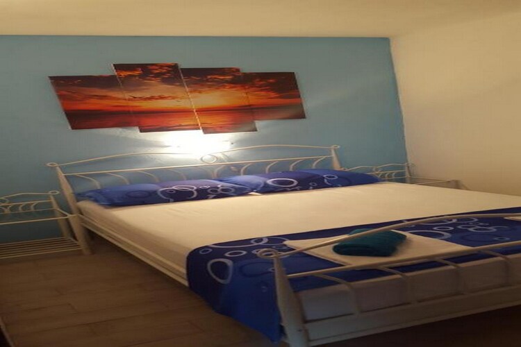 Apartments Katarina are located in a small village Rukavac, on the island of Vis. 

Apartments Katarina offers accommodation in five units. All the units have access to a private furnished balcony or terrace, which makes this place a perfect spot to enjoy your summer holiday. 

You will have access to a common BBQ grill with an outdoor dining area. 

Free private parking is provided, a reservation is not needed.

Luggage storage is possible prior to check-in and after check-out, so you can explore the city a little more before your departure.

Pets are allowed with an additional charge of 5 EUR per day. 

Baby cot and highchair are available upon request.

This two-bedroom apartment can accommodate up to four people. It features air-conditioning as well as SAT LCD TV. The open space living room comes with a sofa and sitting area, and it's combined with the equipped kitchen and dining area. One bedroom comes with a large double bed, while the other one comes with two single beds. The private bathroom comes with a shower and toilet.
Free toiletries, hair dryer as well as linens and towels are at your disposal.

If you want to spend your vacation in a peaceful and quiet environment, far from the city crowds, and also to have nearby all you need during your holidays, Apartments Katarina is the best choice for you. The beach is only 50 m from the property! Due to the properties' good location, you can find restaurants and bars only 100 m away from the property. The market is situated 1 km from the property.

Airport is located 48 km from the property, while ferry port is 9 km away.