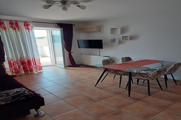 Apartments Snjezana is located in Kampor on the island of Rab, famous for its breathtaking sandy beaches.

Shared BBQ facilities as well as a common terrace fitted with an outdoor dining area are at your disposal.

Apartments Snjezana offers accommodation in two units with a private balcony that overlooks the sea, which makes this place a perfect spot to enjoy warm summer nights. 

Private parking is provided. 

Luggage storage is possible on request. 

A baby cot is available upon request.

This one-bedroom apartment with a balcony and sea view can accommodate up to four people. It features LCD SAT TV as well as air-conditioning. The kitchen is equipped with a refrigerator, freezer, water kettle, stove, coffee maker, and kitchen utensils. The private bathroom is fitted with a shower and toilet. Bed linen as well as towels are at your disposal. You will have access to an iron and ironing board.

In just a few meters away from the property, you will find all the things necessary for a perfect vacation. In the area are restaurants, cafe bars, and grocery stores.  The clostes beach is only 100 m from Apartments Snjezana. Restaurants, Caffes, bars - all can be found within less then 200 m from the apaertment. The closest grocery store is 200 m from the property.

Airport is 130 km away.
