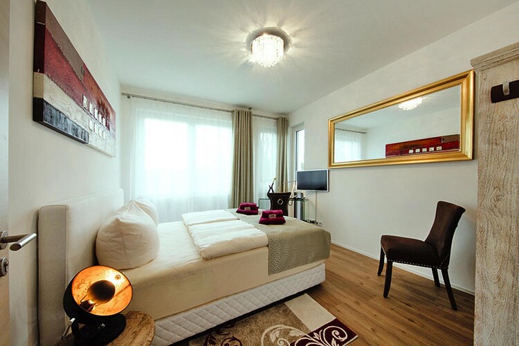 Ground floor: (Kitchen(dining table(8 persons), hob(4 ring stoves, ceramic), electric kettle, toaster, coffee machine, oven, microwave, dishwasher, fridge-freezer), Living/bed room(double bed, TV(flatscreen, satellite), radio, telephone), bathroom(washbasin, toilet))\n\nOn the 1st floor: (bedroom(double bed, TV(flatscreen, satellite)), bedroom(double bed, TV(flatscreen, satellite)), bedroom(double bed, TV(flatscreen, satellite)), bathroom(bath tub, shower, washbasin, toilet, hairdryer))\n\ncarport, baby bath(paid), sauna(shared with other guests), heating(floor heating), terrace, garden, garden furniture, sun loungers, parasol, swimming pool(shared with other guests, heatable, indoor), toys, Charging post for electric cars, baby crib(paid), Towels/Sheets (Incl.)