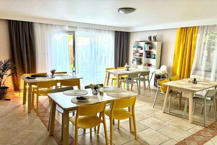 A comfortable holiday home in Międzywodzie, ideal for a large family or group of friends. We have made sure that our guests' holiday is full of pleasant attractions. Guests have at their disposal 10 bedrooms, 10 bathrooms, a large dining room and a spacious and well-equipped kitchen. In our garden there is a playground for children and a gazebo for evening barbecues. To make our guests' time more pleasant, we have created a place with board games and books that everyone can use.
Our holiday home is located in a cosy district of Międzywodzie, approx. 10 minutes' walk from a wide, clean, sandy beach, 5 minutes' walk to the centre.
Both in Międzywodzie itself and in the surrounding towns, there are many attractions waiting for tourists! We especially recommend walks along the shore of Zalew Kamieński (800 m from the guesthouse) - it is also an excellent proposition for anglers! In addition, it is worth visiting the Wolin National Park with its bison reserve, taking a boat cruise on the Kamieński Reservoir or the sea, walking around Międzyzdroje or playing golf on one of the nearby golf courses - Amber Baltic Golf Club in Kołczewo, 10 minutes by car.