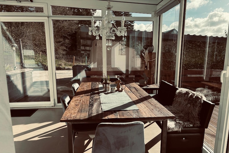 Ground floor: (Living room(TV, seating area), Kitchen(electric kettle, toaster, cooker, hood, coffee machine, oven, microwave, dishwasher, fridge), conservatory(dining table), children\'s bed, high chair)\n\nOn the 1st floor: (bedroom(double bed(180 x 200 cm)), bedroom(double bed(180 x 200 cm)), bathroom(bathtub with shower, washbasin, toilet, hairdryer))\n\nAttic: (bedroom(single folding bed(90 x 200 cm), double bed(180 x 200 cm)), bathroom(shower, washbasin, toilet))\n\ntumble dryer, washing machine, heating(gas), garden, bicycle storage, garden furniture, BBQ, parking, lounge set, Towels/Sheets (Incl.)