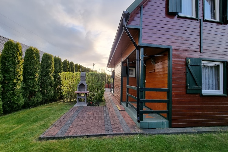 Two-story holiday cottages.

On the ground floor:

a living room with a double sofa bed,

a fully equipped kitchenette,

a bathroom with a shower,

TV,
Internet.

On the first floor:

two separate bedrooms (one with a double bed, the other with a double bed and a single bed),
child safety gates on the stairs.

The cottage also includes: two beach screens, two deckchairs, and an ironing board.

A barbecue and garden furniture are located in front of the cottage.

Karwia offers a variety of accommodation options, ideal for families, couples, and groups of friends. Our accommodations include comfortable rooms, spacious apartments, and charming holiday cottages, all located within close proximity to the beach, forests, and other tourist attractions.

Whether you're planning a short weekend getaway or a longer vacation, our accommodations in Karwia will ensure a comfortable stay and unforgettable memories of your seaside vacation.