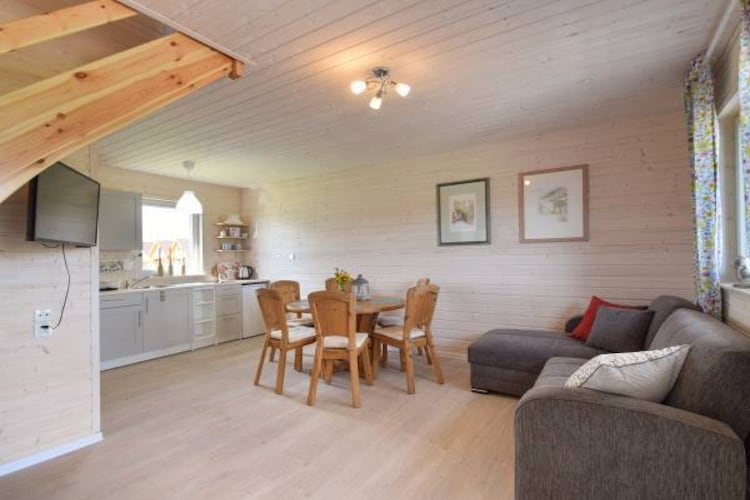 Ground floor: (open kitchen(electric kettle, cooker(2 ring stoves, ceramic), fridge-freezer), Living/diningroom(double sofa bed, TV, dining table), bathroom(shower, washbasin, toilet))\n\nOn the 1st floor: (bedroom(double bed), bedroom(single bed, double bed))\n\nReception, Lawn, garden(shared with other guests), garden furniture, sun loungers, BBQ, parking