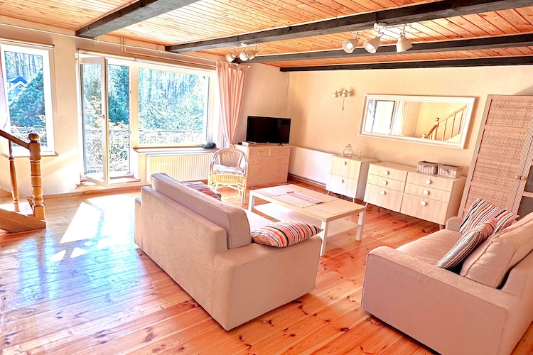 Kopalino is a small seaside holiday village between Dębki and Łęba, surrounded by forests rich in mushrooms and berries.
This comfortable holiday home with a private fenced garden is located 2.8 km from the seaside beach. The house has three floors. On the ground floor, there's a spacious recreation room with direct access to a large, covered terrace, complete with garden furniture, deck chairs, and a barbecue. On the ground floor, there's also an alcove with additional sleeping space (a fold-out sofa bed) and a bathroom with a shower (including a washing machine). On the first floor, there's a living room (TV, dining table, 2 fold-out sofa beds, and a balcony) and a well-equipped kitchen. The sleeping area on the second floor consists of 2 separate bedrooms and an additional fold-out sofa bed in a passageway. The grounds surrounding the house (for guests' exclusive use) include a hammock, parking, and a garage that doubles as a utility room (for storing bicycles or other equipment). Six bicycles are also available on site free of charge. The property welcomes guests with dogs (up to 10 kg) for a fee.
The hostess invites you to her studio in the neighboring village (Choczewo – approximately 9 km) for attractive ceramics workshops – classes for children and adults.
Included in the price: bed linen, towels, electricity, water, final cleaning, bicycles, and parking. A cot, a baby bathtub, and a highchair are available upon request.
There are many scenic, marked cycling routes in the area. Cycling is an excellent way to explore the surrounding area, such as the Lubiatowskie Dunes or the Stilo Lighthouse. Horseback riding is available at the local stud farm. The small Lake Kopalińskie is 850 m from the property. The beach, which is never crowded here, even in the peak tourist season, can be reached on foot, by bicycle, or by car via the paved road (parking is 50 m from the beach).