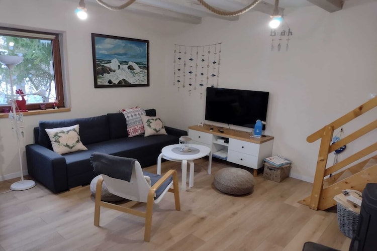 Kopalino is a small seaside holiday village between Dębki and Łęba. The settlement is surrounded by forests, which are rich in mushrooms and berries in autumn. It's a wonderful area for cyclists.
This comfortable, year-round holiday home is situated on a spacious property shared with guests from two other cottages. The house is two-story and features a large, covered terrace with garden furniture and barbecue facilities. On the ground floor there's a living room (with a TV, fireplace, dining table, and a double sofa bed), a well-equipped kitchen, a double bedroom, and two bathrooms with a shower (one of which also has a washing machine). On the first floor there are two further bedrooms and two more bathrooms with a shower. Central heating and a fireplace are provided. Wireless internet is available.
The fenced property offers secure parking and an attractive playground.
The price includes: bed linen, towels, electricity, water, heating, final cleaning, internet, and parking. A cot, highchair, and bathtub are available upon request. There are many picturesque, marked cycling routes in the area. Cycling is an excellent means of transportation for exploring the surrounding area, such as the Lubiatowskie Dunes or the Stilo Lighthouse. Horseback riding is available at the local stud farm. The small Kopalińskie Lake is 900 meters from the house. The beach, which is never crowded here, even during peak tourist season, can be reached on foot, by bike, or by car along the paved road (parking is 50 meters from the beach).