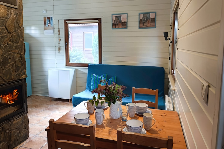 Kopalino is a small seaside holiday village between Dębki and Łęba. The settlement is surrounded by forests, which are rich in mushrooms and berries in autumn. It's a wonderful area for cyclists.
This comfortable holiday home is situated on a spacious property shared with guests from two other houses. The two-story cottage features a large, covered terrace with garden furniture and barbecue facilities. The ground floor features a living room (with a TV, fireplace, dining table, and a double sofa bed), a well-equipped kitchen, and a bathroom with a shower. The first floor has two double bedrooms. Heating is provided by a fireplace and an electric heater in the living room. Wireless internet is available.
The fenced property offers secure parking and an attractive playground.
The price includes: bed linen, towels, electricity, water, final cleaning, internet, and parking. A cot and highchair are available upon request.
There are many picturesque, marked cycling routes in the area. Bicycles are an excellent way to explore the surrounding area, such as the Lubiatowskie Dunes or the Stilo Lighthouse. Horseback riding is available at the local stud farm. The small Kopalińskie Lake is 900 meters from the house. The beach, which is never crowded here, even during peak tourist season, can be reached on foot, by bike, or by car along the paved road (parking is 50 meters from the beach).