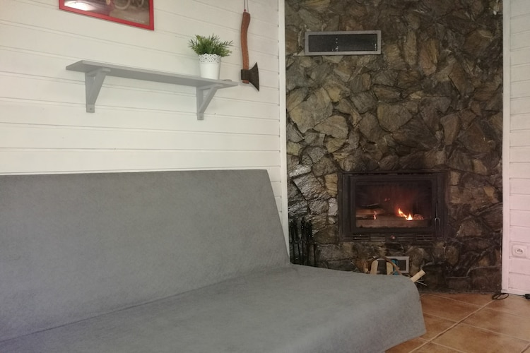 Holiday home with a fireplace and a large terrace