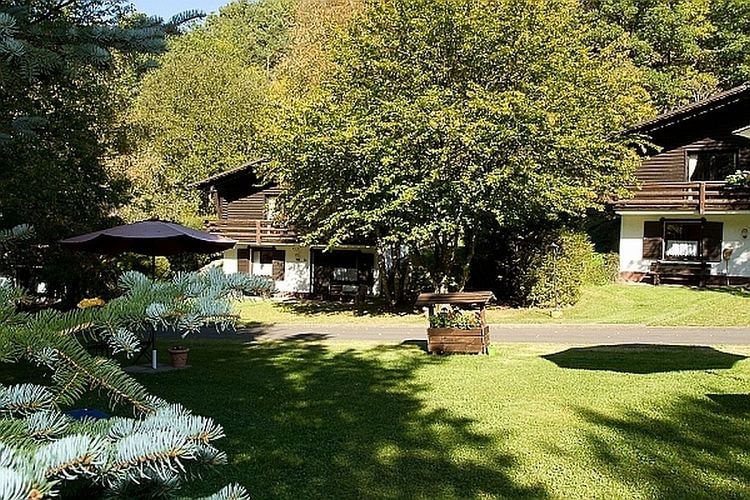 Tidy chalet with fireplace, located in wooded area